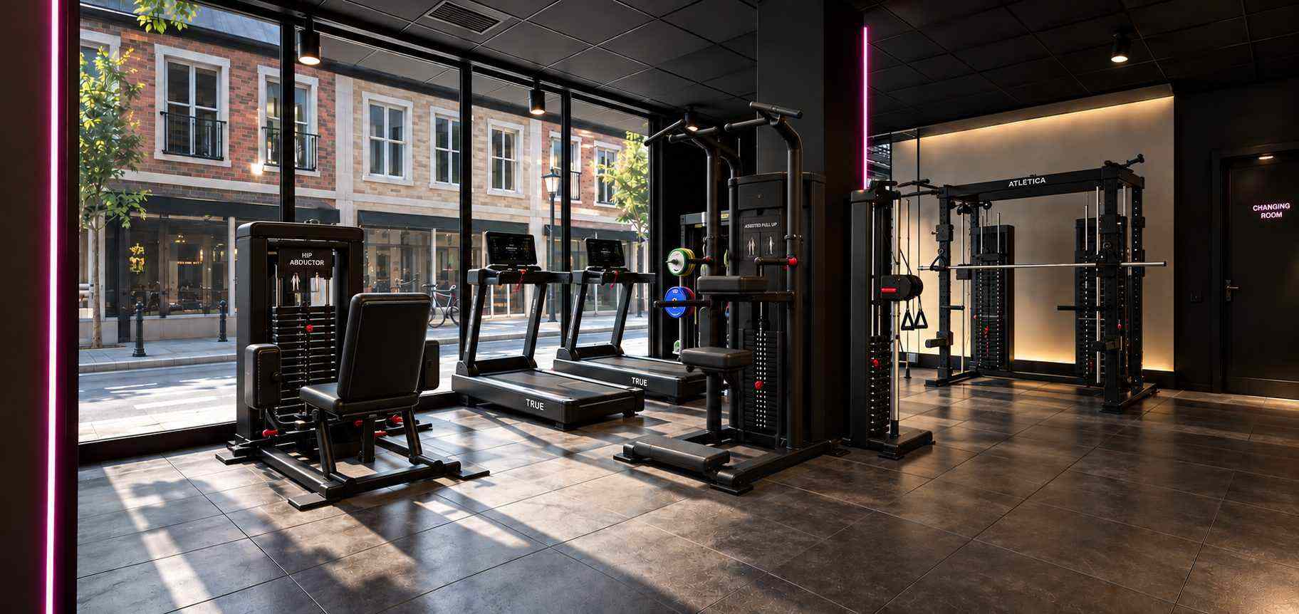 Strength machines and treadmills by the big street-side windows.